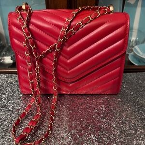 RED BAG-lovely with crossbody strap, unbranded very pretty. Slight callout